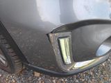 a close up of a car ' s front bumper and tail light