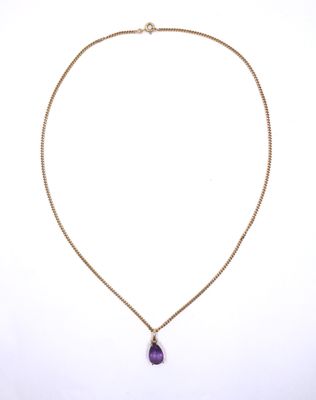a necklace with a purple stone on a gold chain
