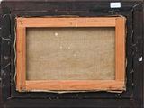 an old picture frame with a piece of paper on top of it