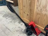 a black and red machine that is sitting on the floor
