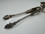 two spoons that are sitting next to each other