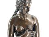 bronze statue of a woman holding a baby in her arms