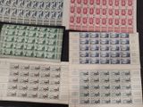 four different types of stamps are on a black surface