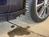 a close up of a tire on the side of a road