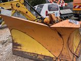 a yellow bulldozer that is sitting in the dirt