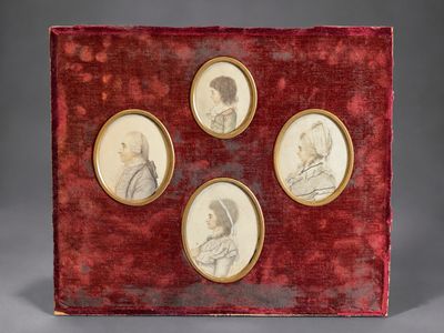 four framed portraits of people in red velvet with gold trim
