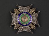 a close up of a badge on a black surface