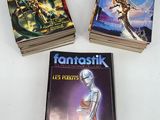 three books are sitting on a table with a white background