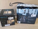 two boxes of headphones sitting on a cardboard box