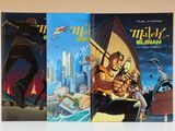 trois livres posés sur une table