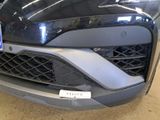a close up of the front of a car with a license plate on it