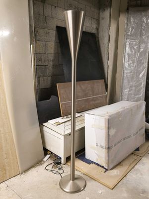a picture of a floor lamp in the middle of a room