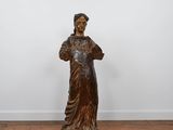 an image of a statue of a woman standing on a wooden floor