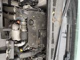 the engine compartment of a car with a bunch of wires attached to it