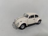 a small toy car that is sitting on a white surface