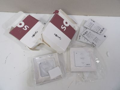 four packages of electronic devices sitting on a table