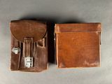 two pieces of brown leather are sitting next to each other on a table