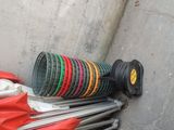 a pile of different types of garden hoses on the ground