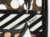 a black and white fish with polka dots on it