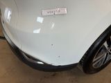 a sticker on the hood of a white car
