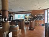 bottles of wine are lined up on the shelves in a wine shop