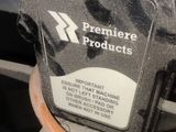 a person that is holding a machine with a label on it