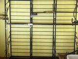 a shelf with a basket on top of it in a room