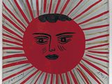 une photo d'une assiette rouge et dorée sur laquelle figure un visage
