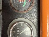 a close up of a gauge on the dashboard of a vehicle