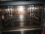 an open oven that has a lot of food inside of it