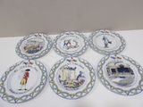 six assiettes ornées de motifs différents, posées sur un fond blanc
