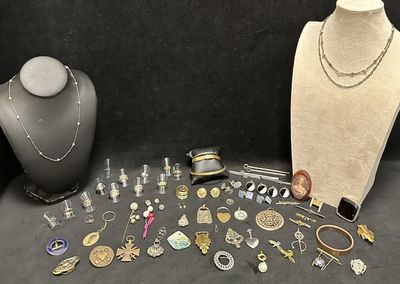 several different types of jewelry are displayed on a mannequin