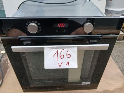 a black oven with a digital clock on top of it