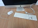 a computer monitor, keyboard, mouse and mouse on the desk