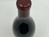 a bottle of wine that is sitting on a table