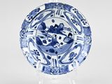 an image of a blue and white plate with a design on it