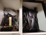 two open cabinets with guns and other items in them