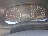 a close up of a car dashboard with a speedometer and gauges