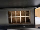 a picture of the inside of a stove with wood in it