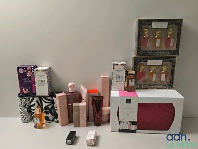 a lot of beauty products sitting on a white table