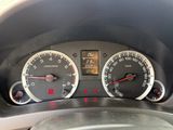 a close up of a car dashboard with a clock and gauges