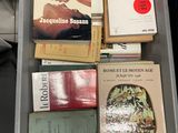 a lot of books on a table in a room
