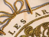 a close up of a tie that is tied to a piece of cloth