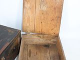 two wooden boxes sitting next to each other on a white surface