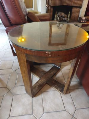 a glass table with candles on it in a living room