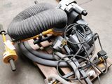 a pile of hoses and a blower on a pallet