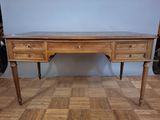 a wooden desk with two drawers on top of it