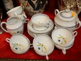 a lot of cups and saucers on a table