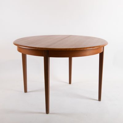 an image of a round dining table with two legs and a wooden top