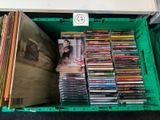 a green box filled with cds and cds